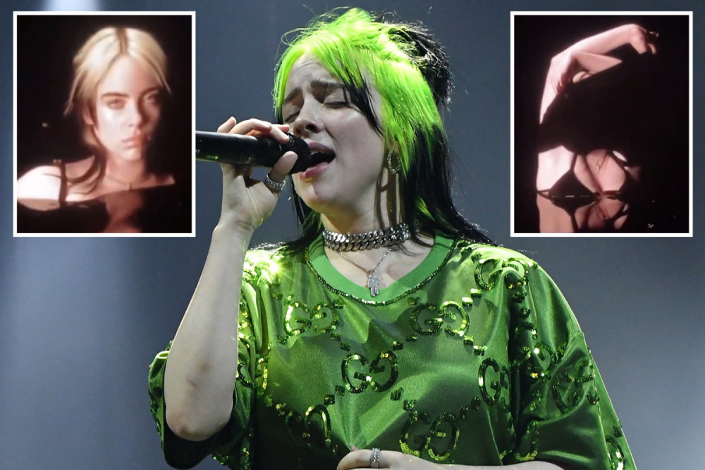 Hình ảnh quen thuộc của Billie Eilish với mái tóc xanh, bộ quần áo rộng màu xanh và hình ảnh trong clip được cô phát ngay tại sân khấu.