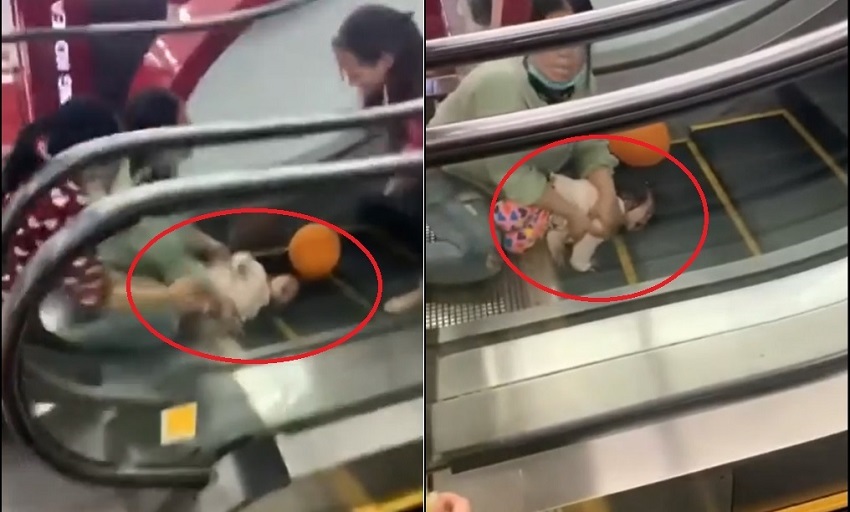 Hình ảnh em bé bị cuốn tay trong thang máy tại siêu thị được cho là ở Việt Nam (Ảnh internet)