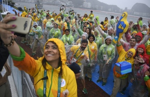 Những tình nguyện viên quốc tế là bộ phận quan trọng tại Thế vận hội, dù vậy họ đang băn khoăn về vai trò của mình tại một Olympic thu nhỏ