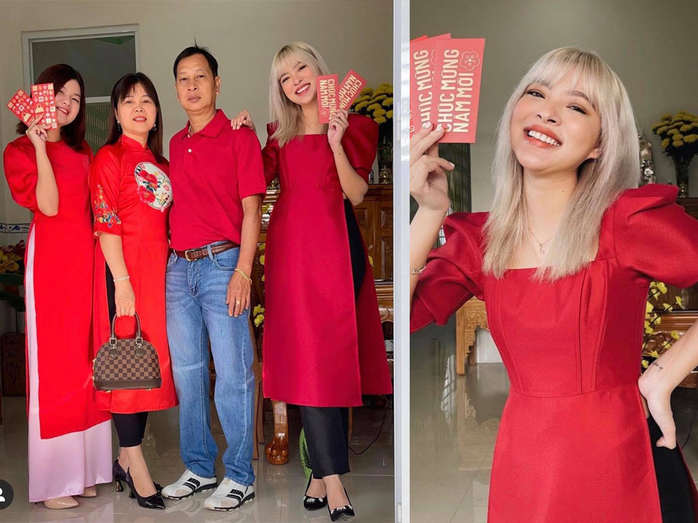 Người mẫu Tú Hảo diện áo dài đỏ, khoe nhận được lì đầu năm mới. 