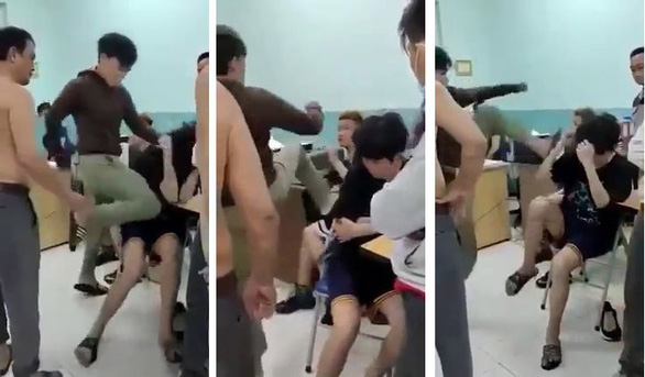 Hai thiếu niên 14 tuổi bị đấm đá dã man tại phòng giám thị Trường THCS Nguyễn Văn Tố, quận 10 (Ảnh cắt từ clip)