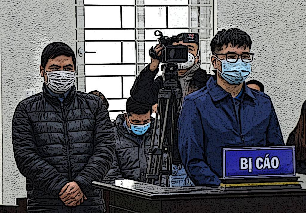 Bị cáo Mai Phan Lợi (phải) cùng đồng phạm tại tòa