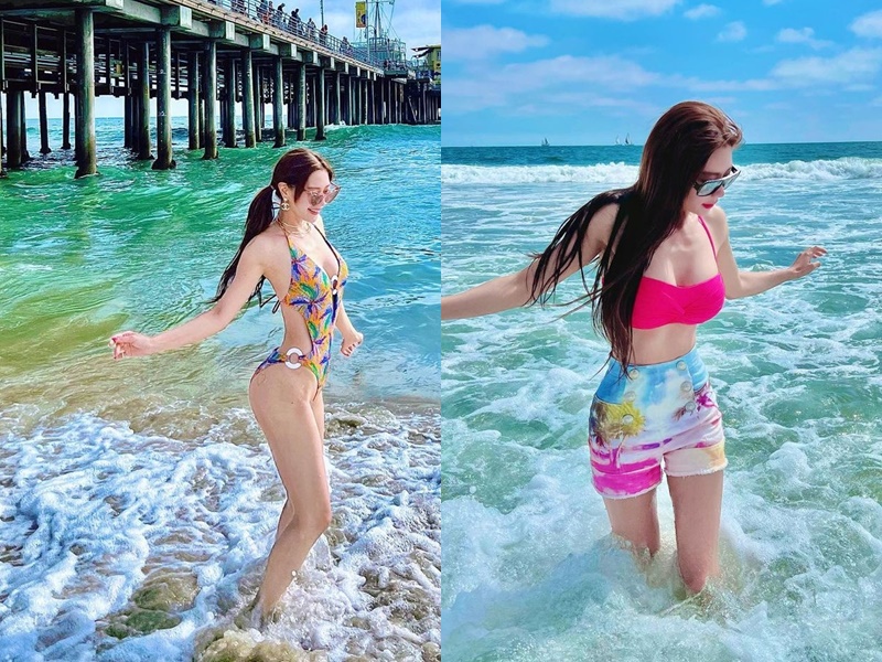 Nữ diễn viên gốc Hàn Clara Lee diện bikini top màu hồng cánh sen mix với  shorts cạp cao họa tiết biển cả mang đến vẻ ngoài nóng bỏng ''đốt mắt''. Ngoài ra, thiết kế monokini cut out cực táo bạo cũng giúp cô nàng phô diễn đường cong triệt để.