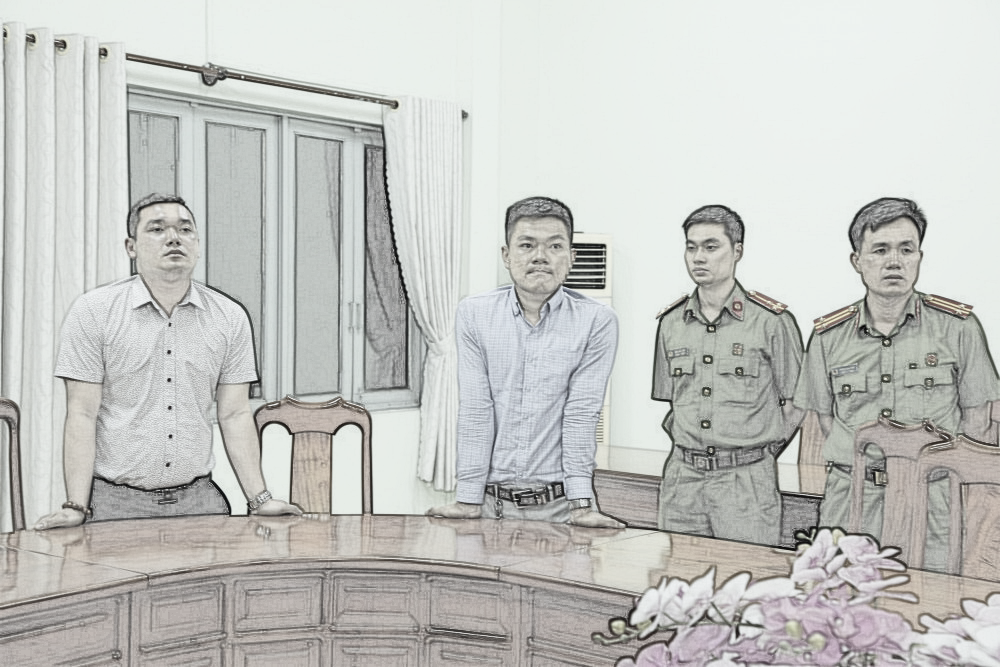 Từ trái sang: Nguyễn Thanh Hùng - tổng giám đốc và Hoàng Anh Vui - giám đốc pháp lý Công ty Bình Dương City Land nghe đọc lệnh bắt tạm giam