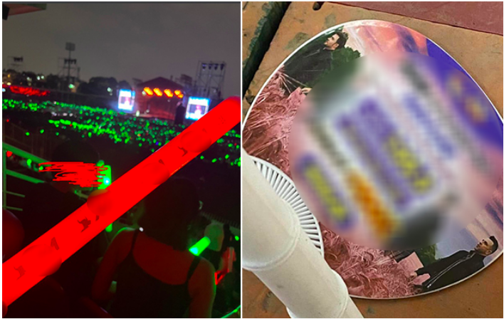 Lightstick và quạt in logo, hình ảnh (đã được làm mờ) của sàn giao dịch tiền ảo, cá độ xuất hiện tại sự kiện.