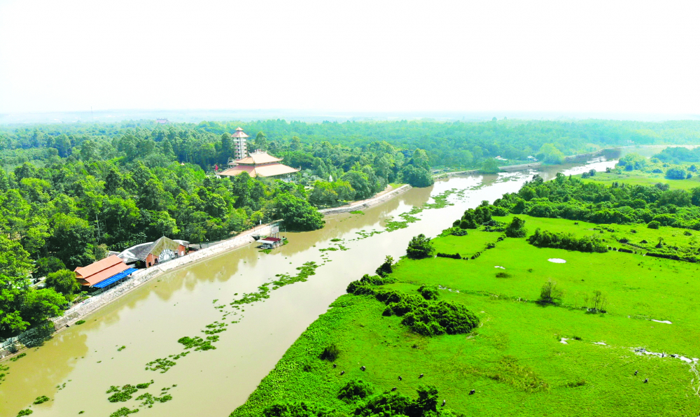 Nhà vườn ven sông ở Củ Chi - Ảnh: Sơn Vinh