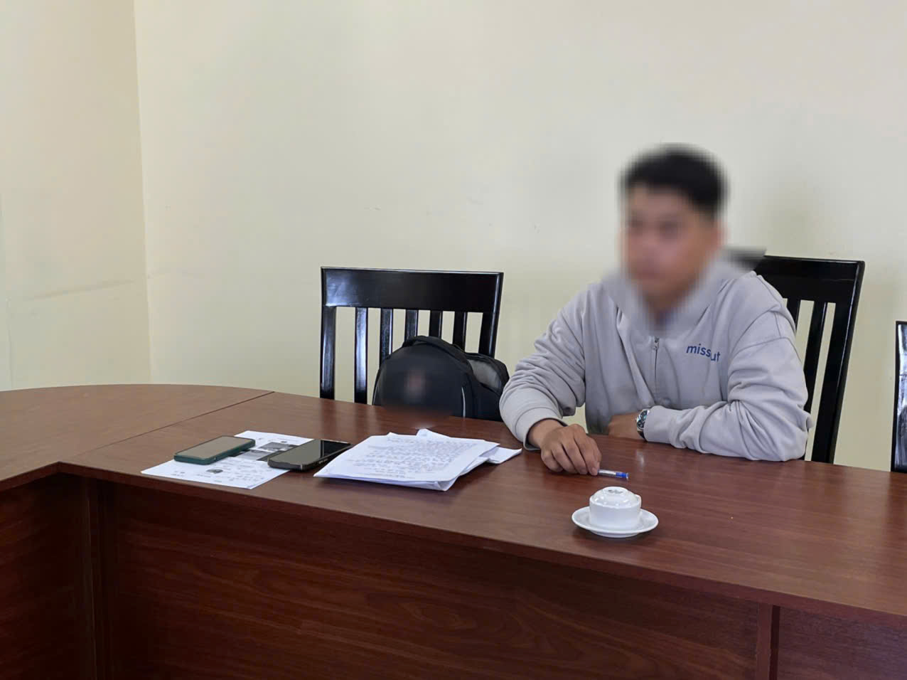 T tại cơ quan công an. Ảnh: CACC