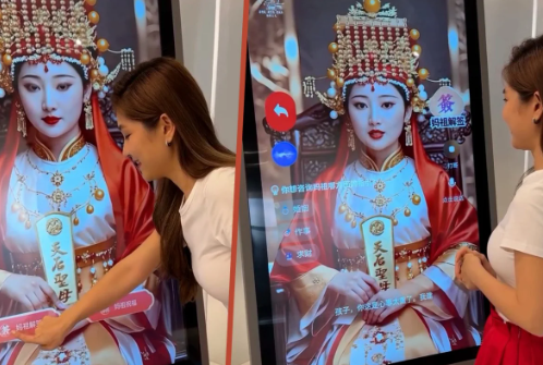 Những người sùng bái tỏ ra thích thú khi xem vị thần kỹ thuật số tại ngôi đền ở Malaysia. Ảnh: Weibo