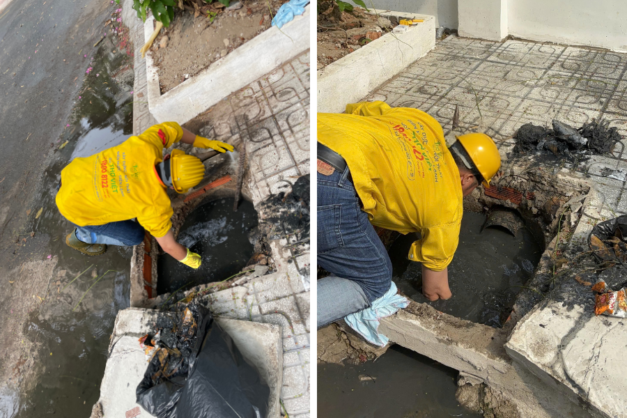 Cống bị nghẹt dẫn đến nước thải ứ đọng, bốc mùi gây ảnh hưởng đến sinh hoạt đang được kỹ thuật viên môi trường của Thợ Việt xử lý - Ảnh: Thợ Việt