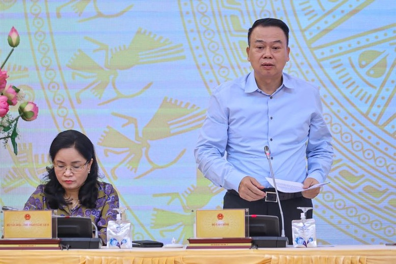 Thứ trưởng Bộ Tài chính Nguyễn Đức Chi trả lời câu hỏi của phóng viên về thí điểm giao dịch tài sản mã hóa (Ảnh: Nhật Bắc)