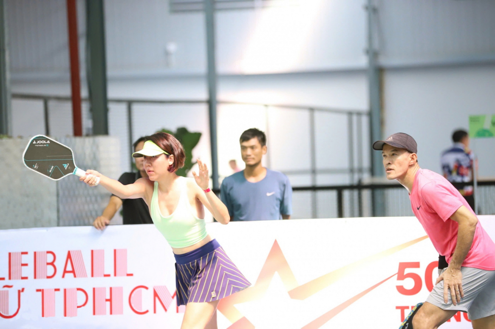 Vợ chồng anh Võ Hoàng Tâm - chị Vũ Bích Dung sát cánh trên sân đấu mùa 2 - ẢNH: THÀNH LÂM