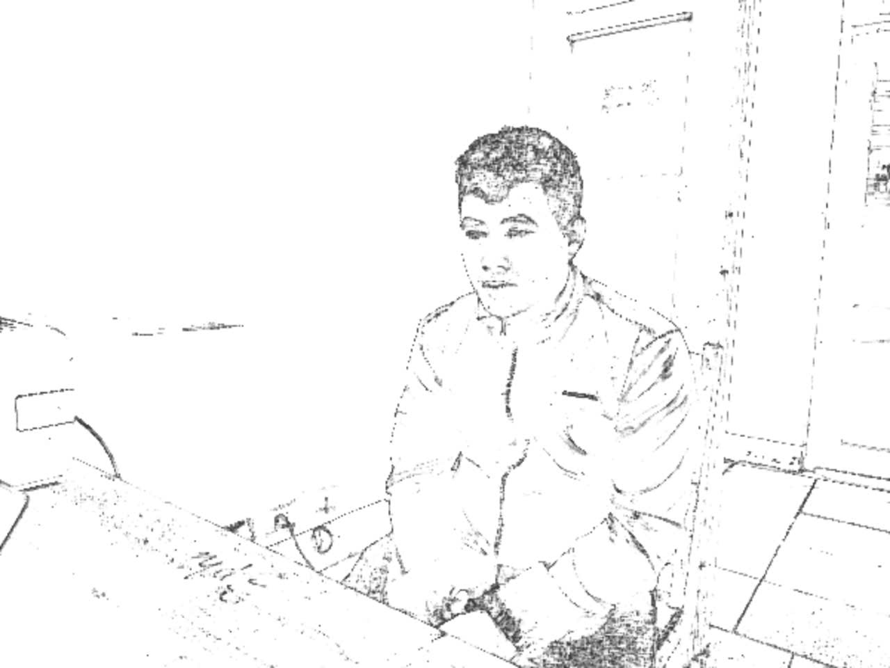 Đối tượng Phạm Ngọc Khánh làm việc tại cơ quan công an - Ảnh: V.D.