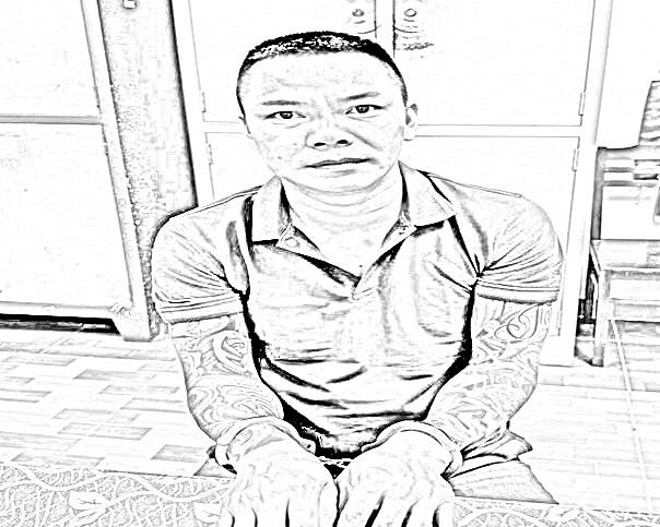 Đối tượng Phạm Ngọc Triều tại cơ quan công an - Ảnh CACC