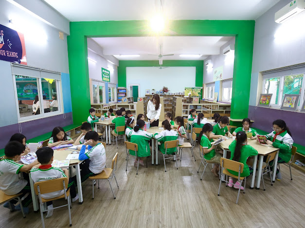 Tiết học đọc sách của học sinh ở thư viện. Ảnh: Phan Ngọc