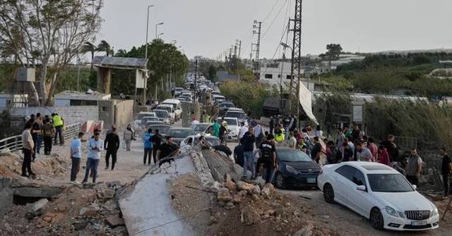  Những người dân Lebanon trở về nhà sau thỏa thuận ngừng bắn giữa Hezbollah và Israel - Ảnh: Mohammed Zaatari