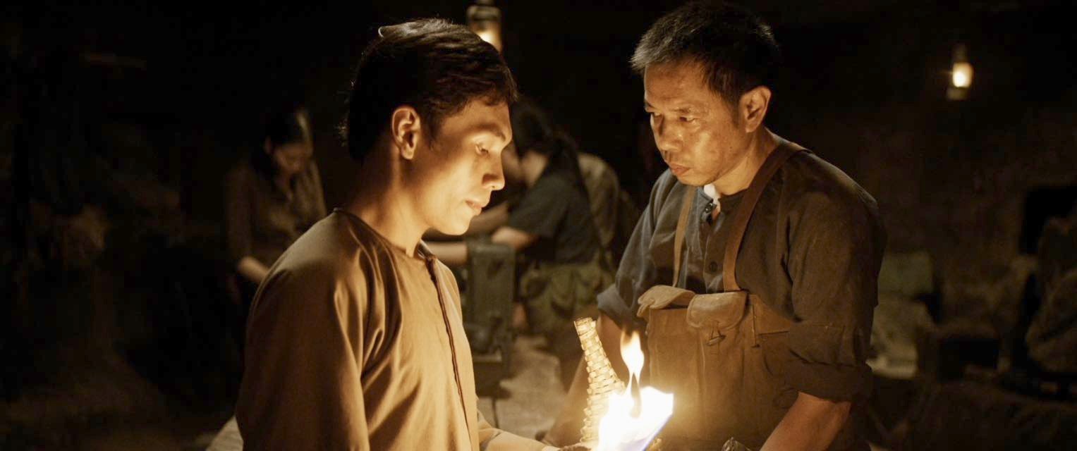 Diễn viên Hoàng Minh Triết (trái) và diễn viên Thái Hoà trên phim Địa đạo