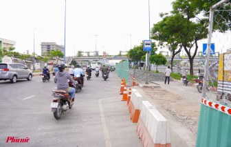 Cận cảnh san bằng dải phân cách để mở rộng đường Võ Văn Kiệt