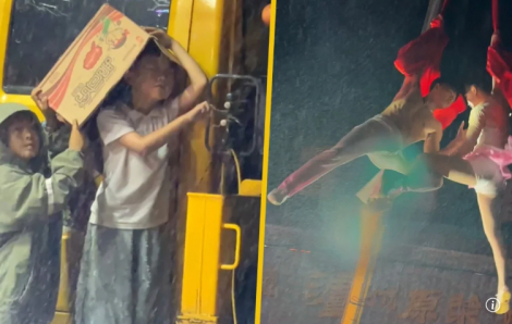 Cậu bé 6 tuổi điều khiển cần cẩu cho cha mẹ biểu diễn nhào lộn kiếm tiền trong mưa khiến hàng triệu người xúc động