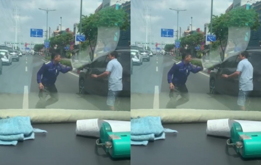 2 người đàn ông rượt đuổi, đánh nhau trên đường Phạm Văn Đồng